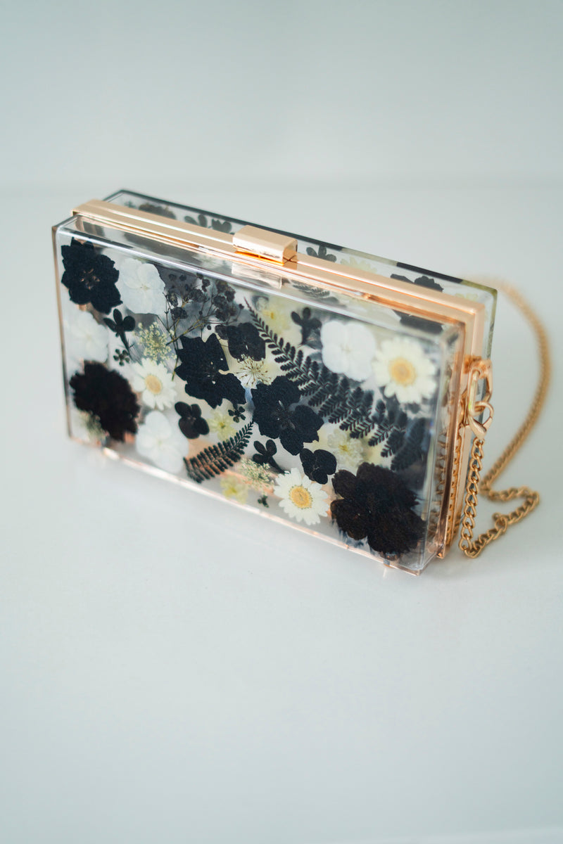 BLACK/WHITE FLORAL CLUTCH